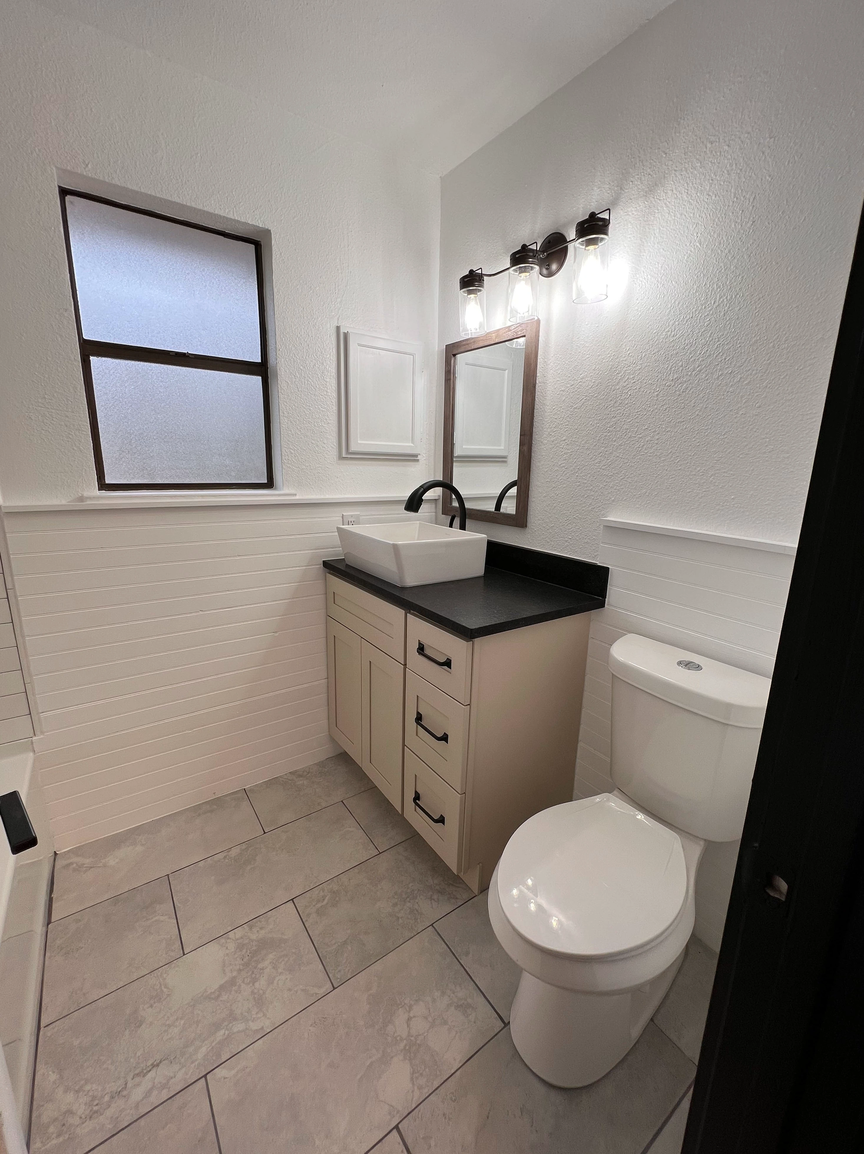 Home remodel in New Braunfels with kitchen remodel and bathroom remodel including custom tile work  completed by Kirk Homes Services.